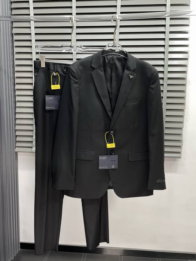 suit. Blazer and trousers. Prada's newest suit, a simple, casual blazer ordered