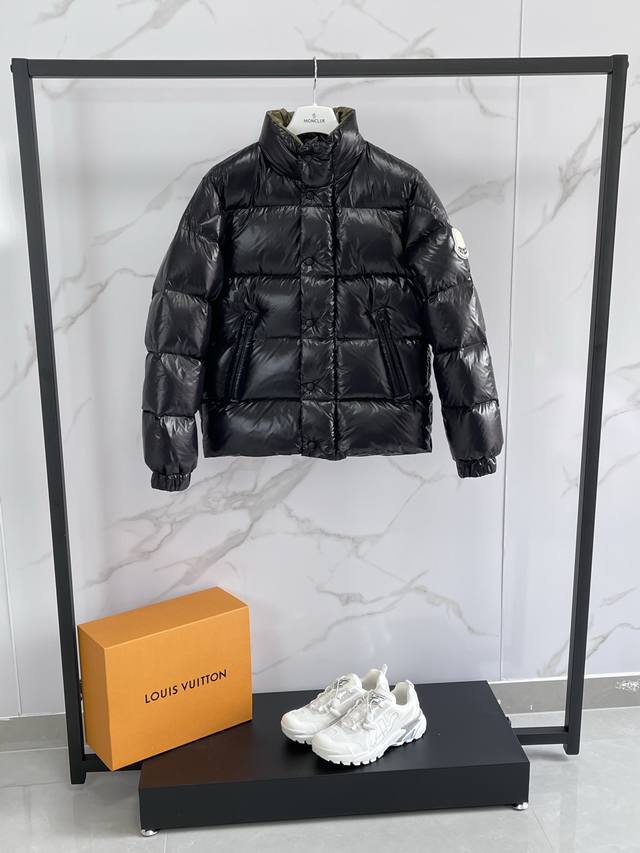 Moncler's new Tripiti men's short down jacket. Made from functional glossy nylo