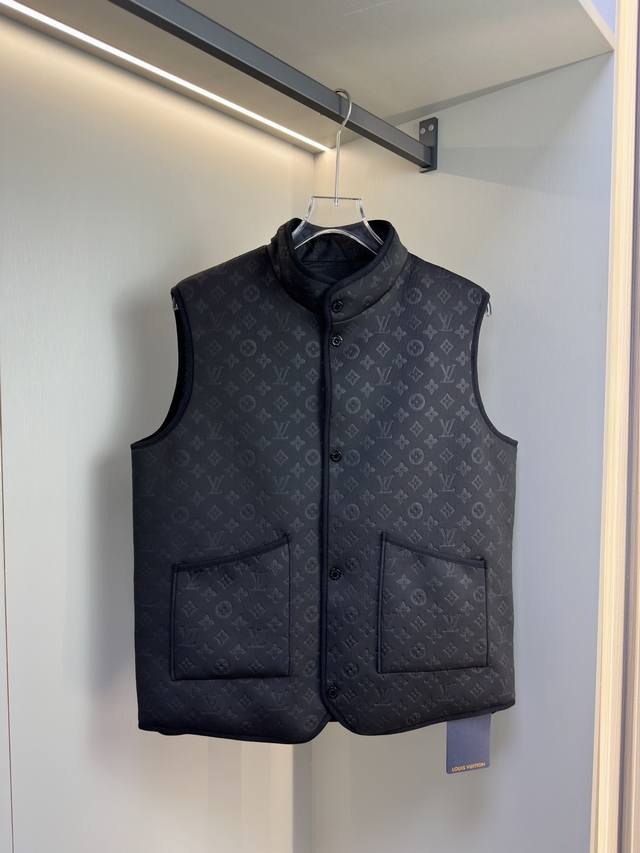 New Reversible Vest Lv This reversible jacket offers two distinct looks. One si
