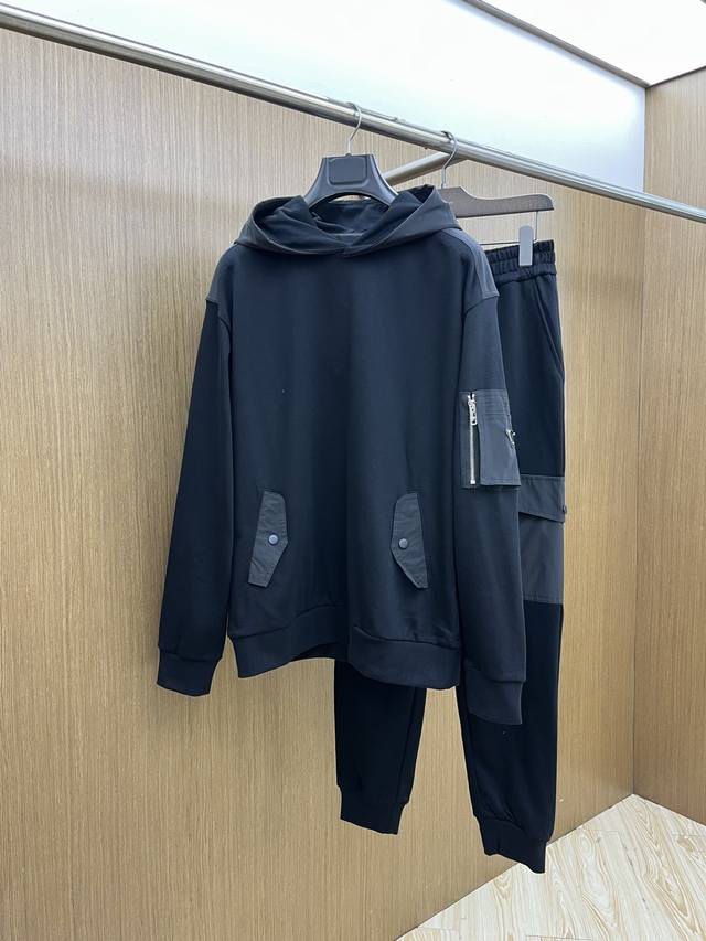 This black hooded sweatshirt from Prada is the perfect blend of style and comfo
