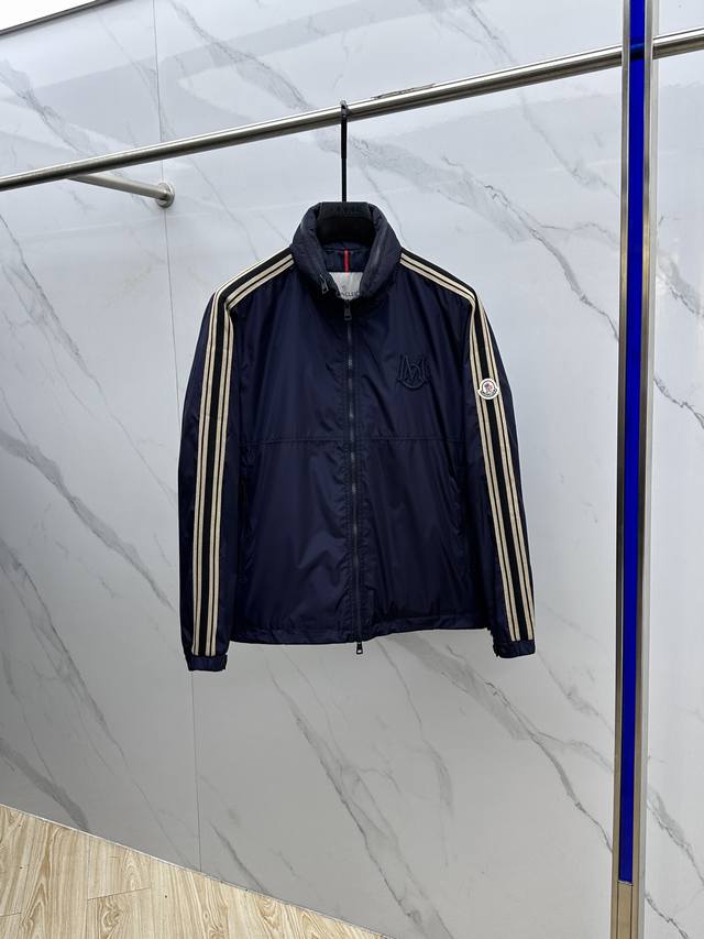 Moncler's new lightweight hooded jacket for early fall 2025. The hood is stowabl