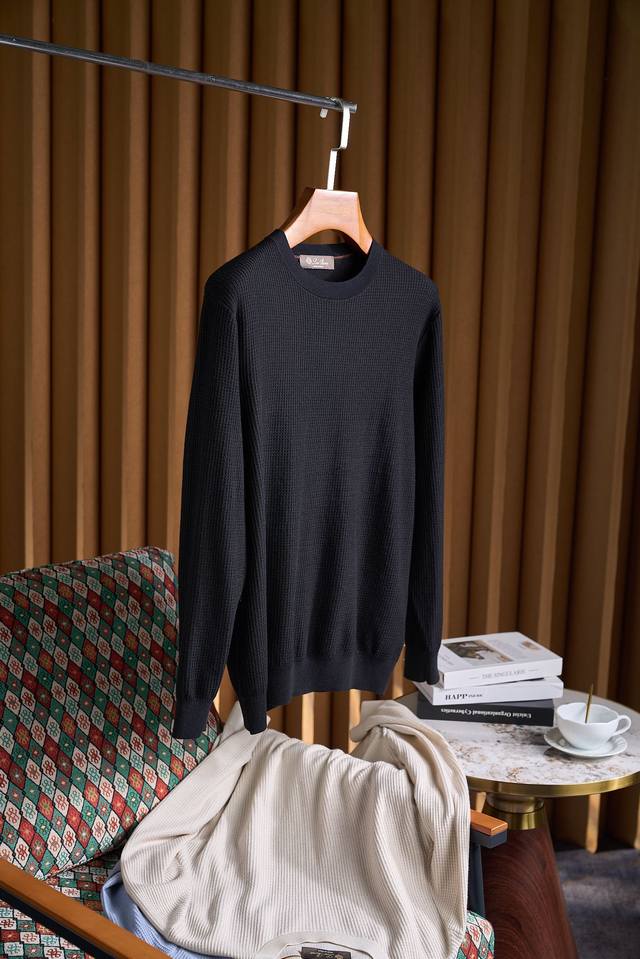 A sweater you can wear inside or outside! Made with a wool and silk blend, this
