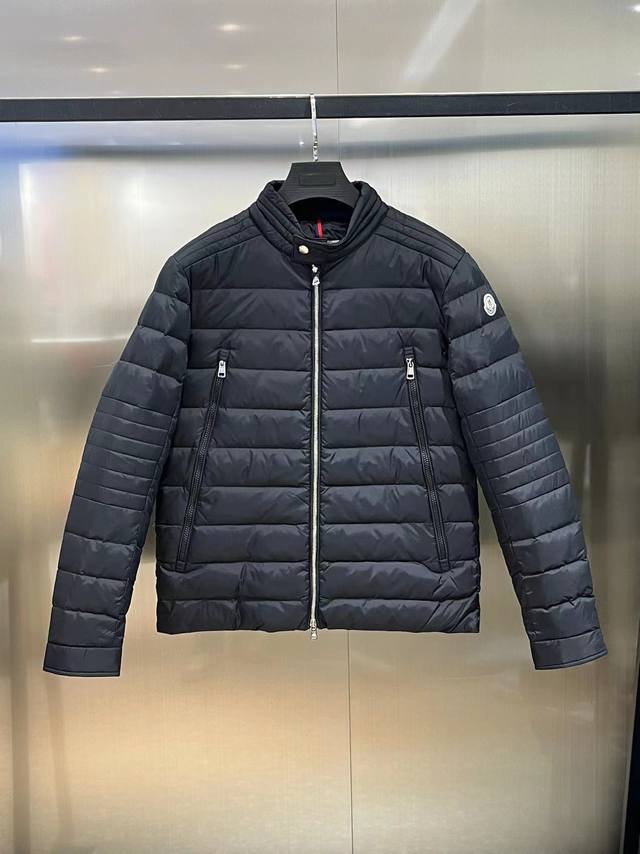 Moncler down jacket with a simple stand-up collar. Lightweight and lightweight,