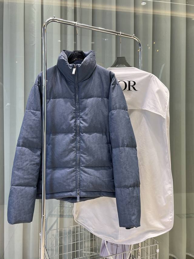This 25-year-old jacket features Dior's iconic Oblique print. Crafted from black