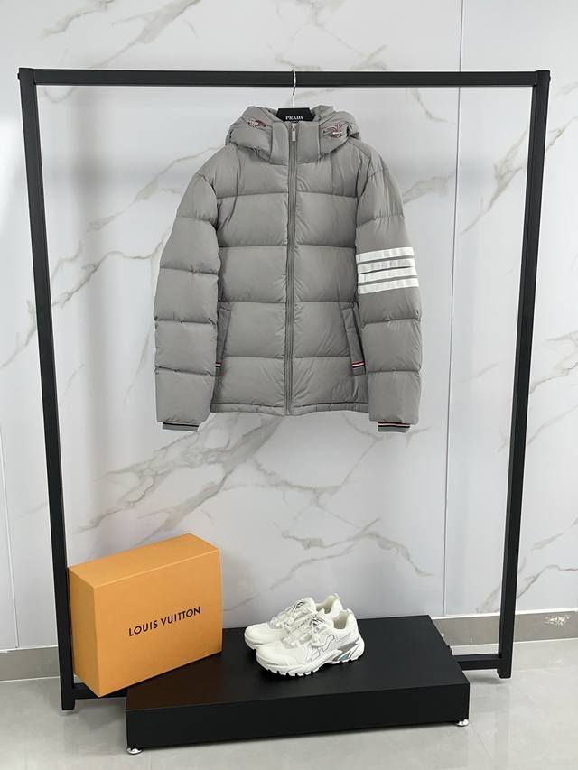 2025 Thom Browne. Thom Browne classic four-bar hooded down jacket. Unisex couple