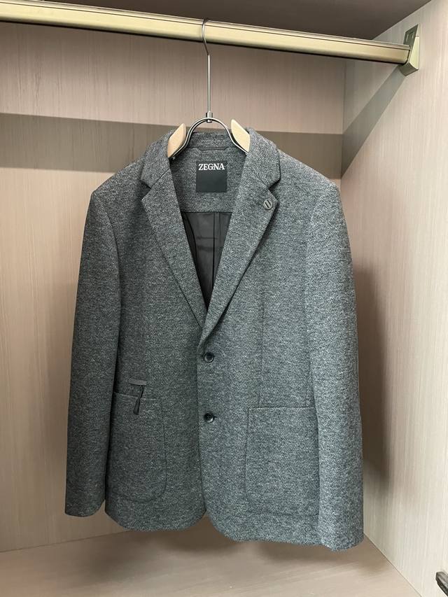 This Ermenegildo Zegna wool suit is the business gentleman's signature style! Cr