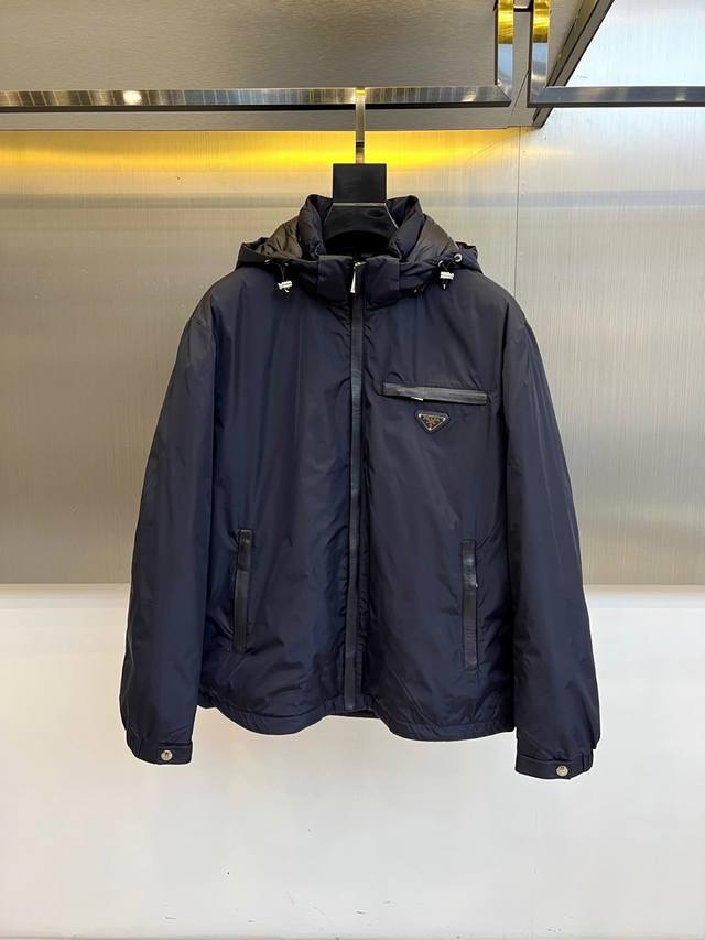 Prada's new down jacket for Fall/Winter 2025 showcases a modern, minimalist aes