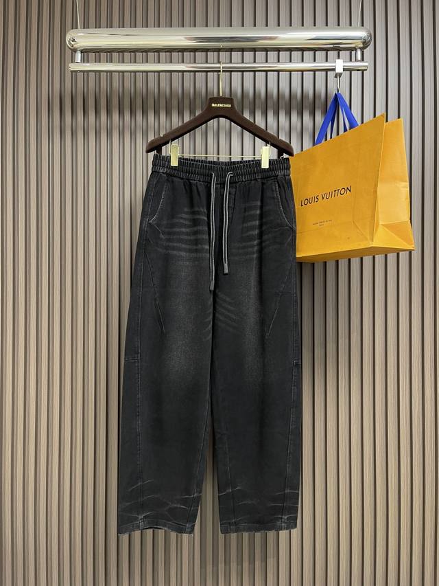Mm6 These washed, frayed black scimitar pants are made from premium denim, treat