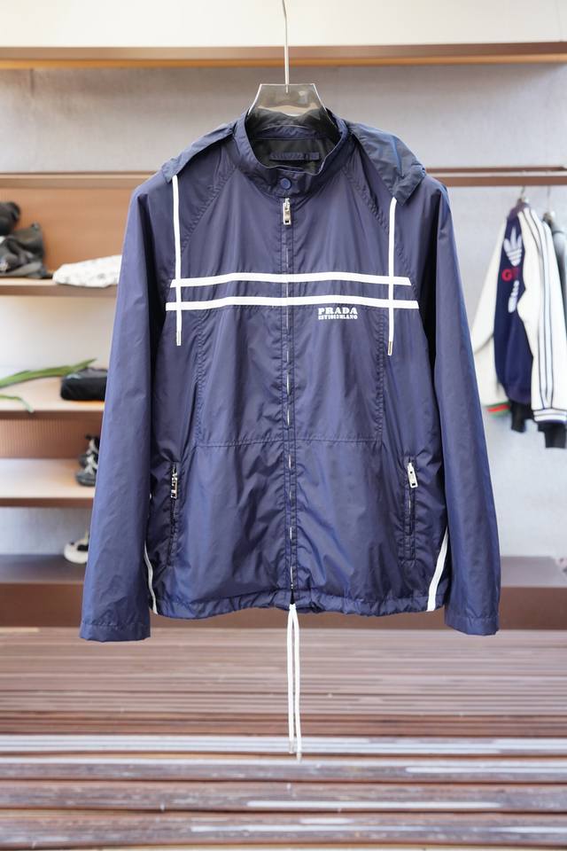 Prada's new Re-Nylon jacket features a contrasting zipper placket, a stand-up c