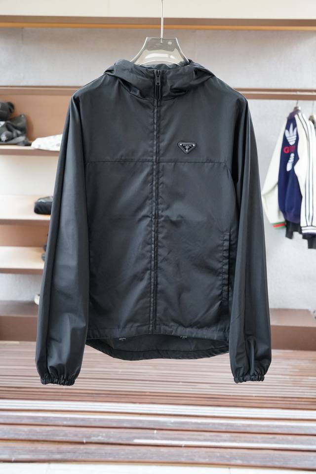 Prada's new Re-Nylon jacket features a contrasting zipper placket, a stand-up c