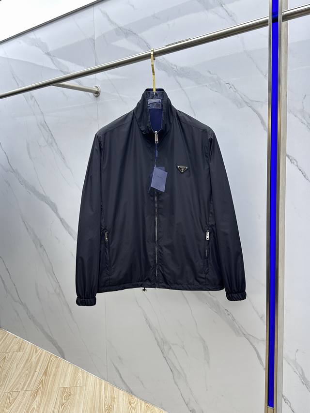 prad* Prada's new Fall/Winter 2025 jacket features a stand-up collar and is reve