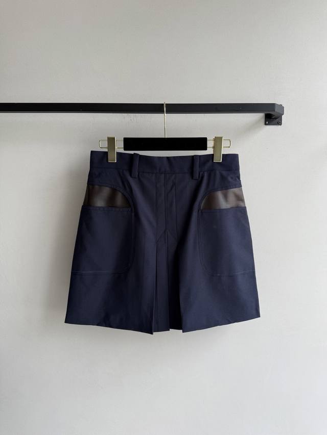 prad* This new early fall navy blue A-line skirt features a clean silhouette wit