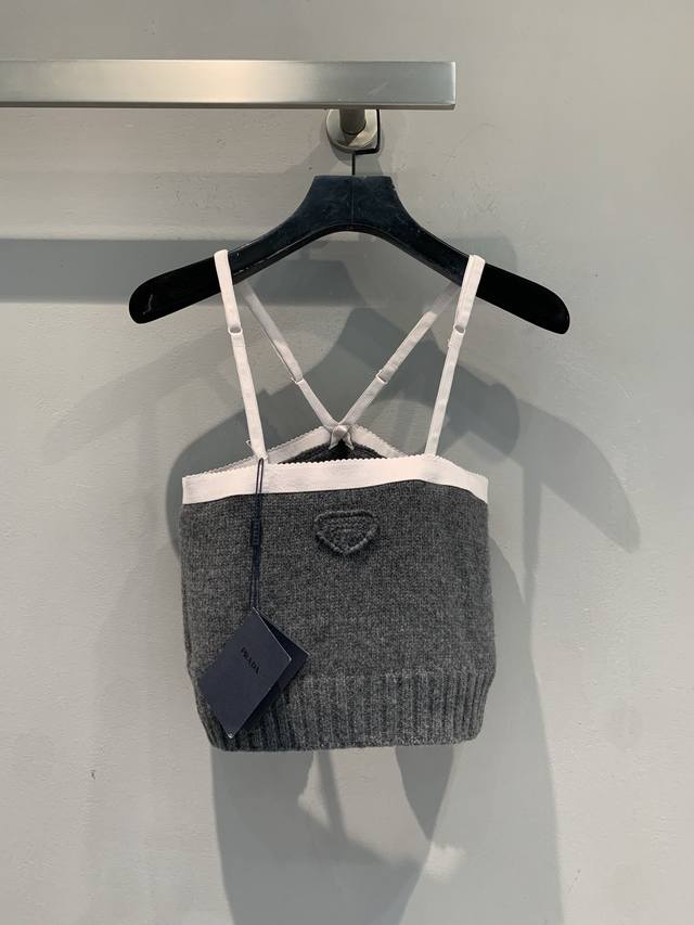 Originally developed by prad*, this stylish and versatile contrast-trimmed knit