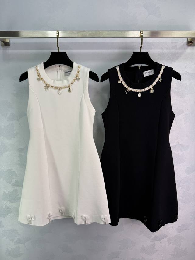 Chane* Chanel-inspired dress, available in black and white, features a delicate