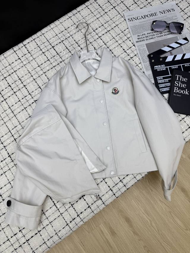 Moncle*25's new hooded trench coat features a classic logo, creating a casual, s