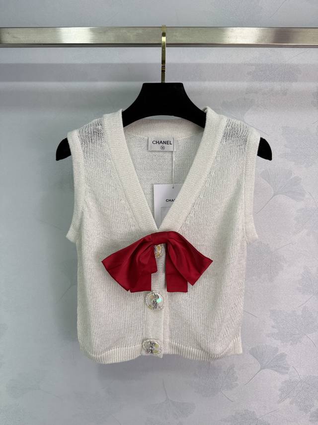 Ch*25 New early fall knitted vest with a red bow and rhinestone buttons on the c