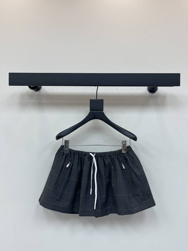 Miumi*25's new plaid drawstring tutu skirt. Featuring a white drawstring waist,