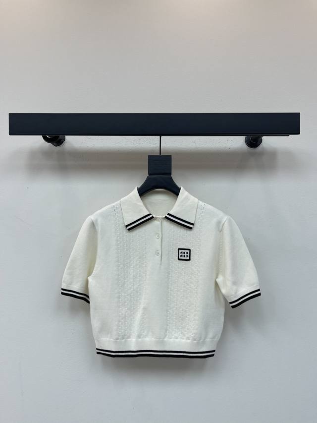 Miumi*25's new, preppy-inspired polo-neck cropped knit top for early fall. This