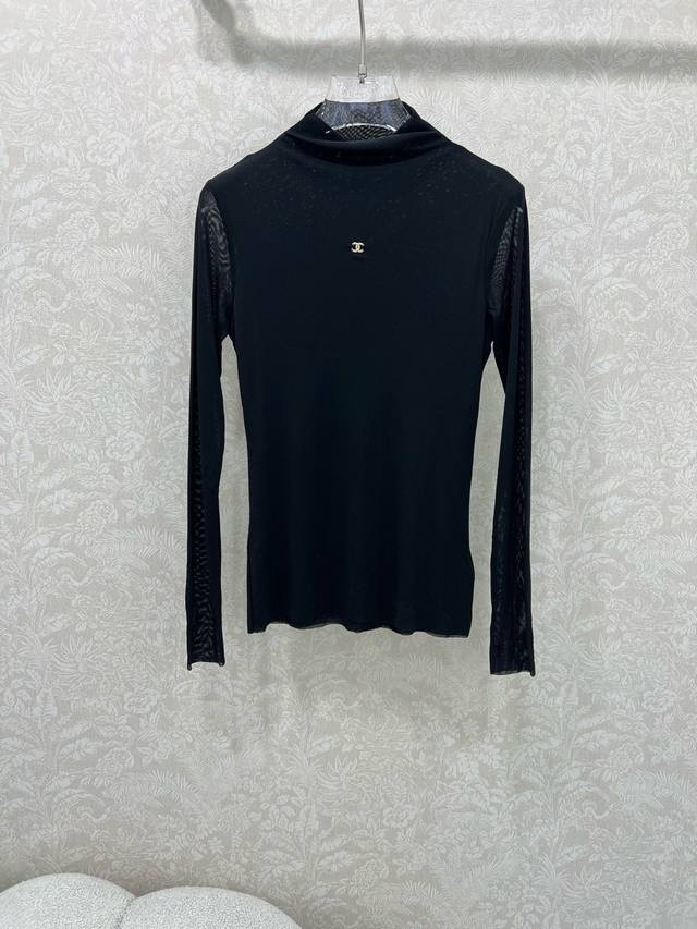 Chan*L25's new mesh-trimmed top with a slightly piled collar and a double C on t
