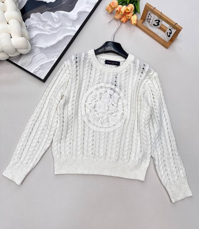 Louis Vuitton's new openwork knit sweater...this one is so gorgeous! It's so coo