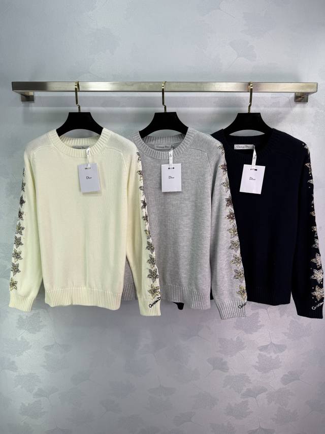 Dio*25's new early fall sweater with embroidered sleeves features a round neck p