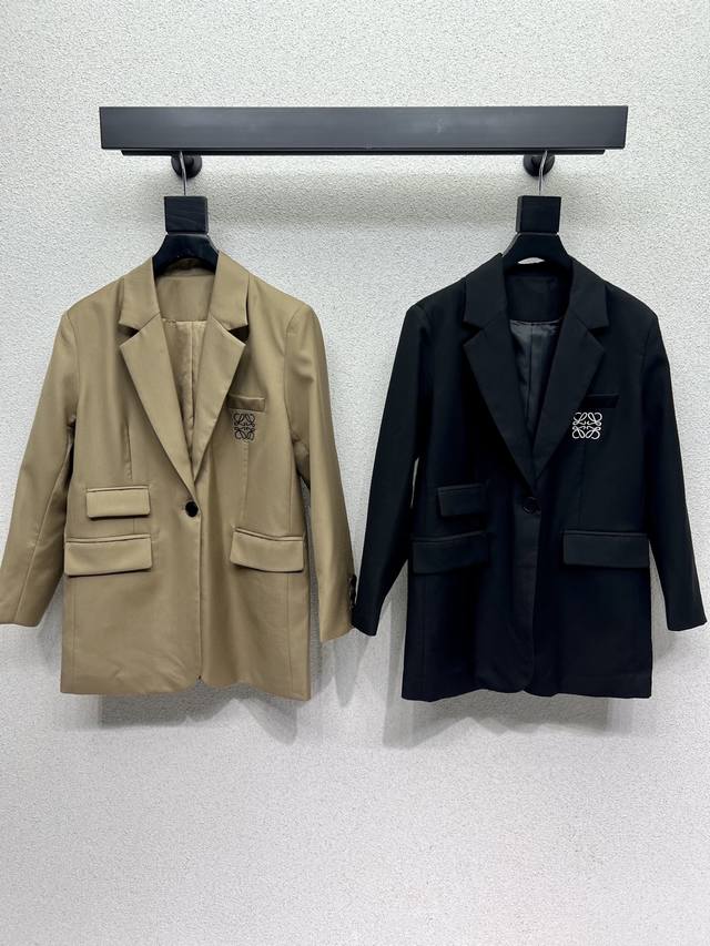 Loewe's embroidered logo blazer with a belt is elegant and stylish. The solid co