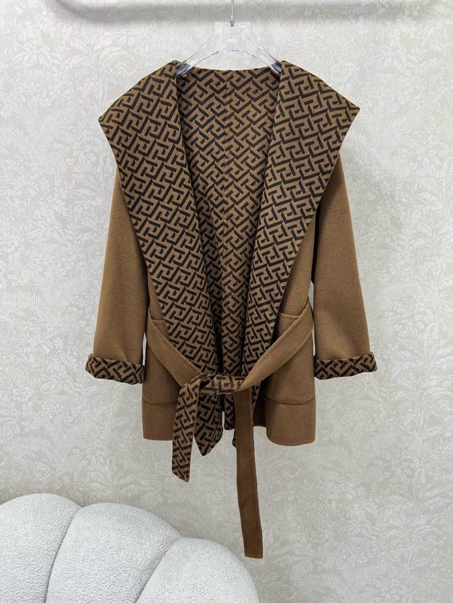 Fend*25's new hooded wool coat features a custom, double-sided logo print for a