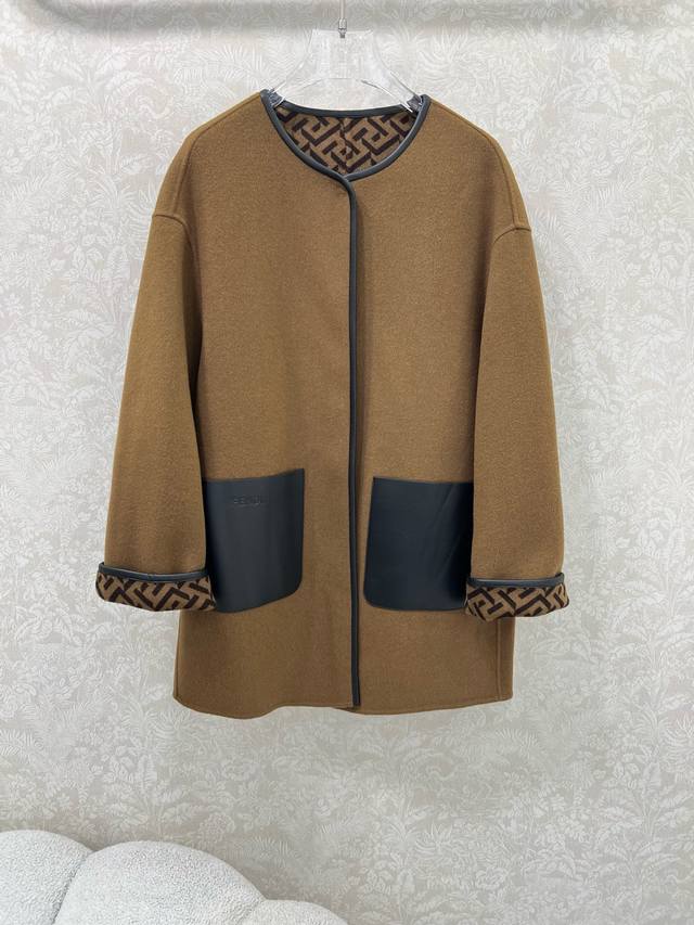 Fend*25's new wool coat features a custom, double-sided logo print for a stylish