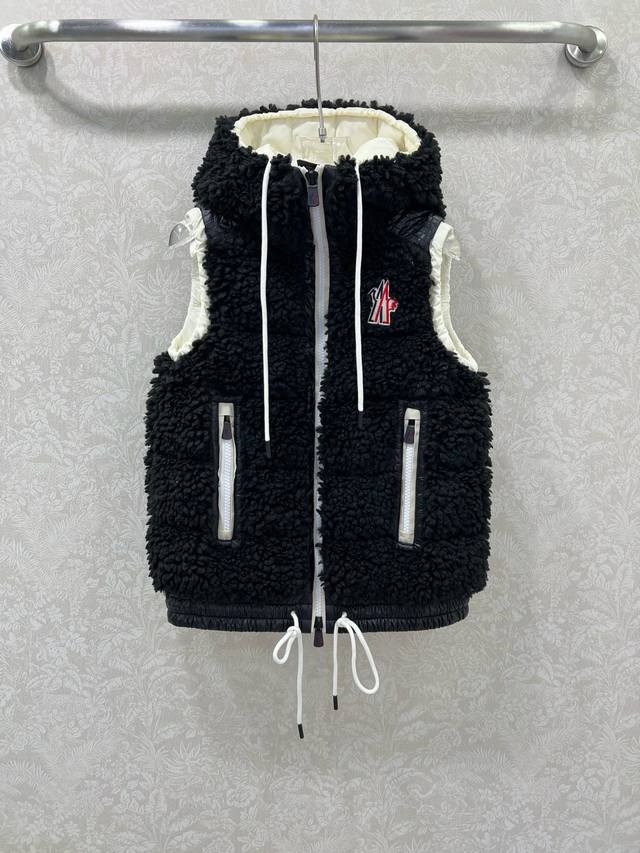 Moncle's new ski collection faux lambswool down vest from 2025. Custom-made eco