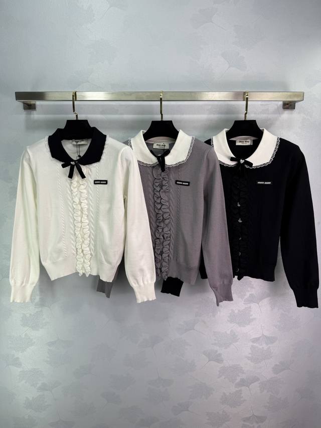 Miu*25's new early fall sweater with a doll collar and ruffled hem and a bow. Th