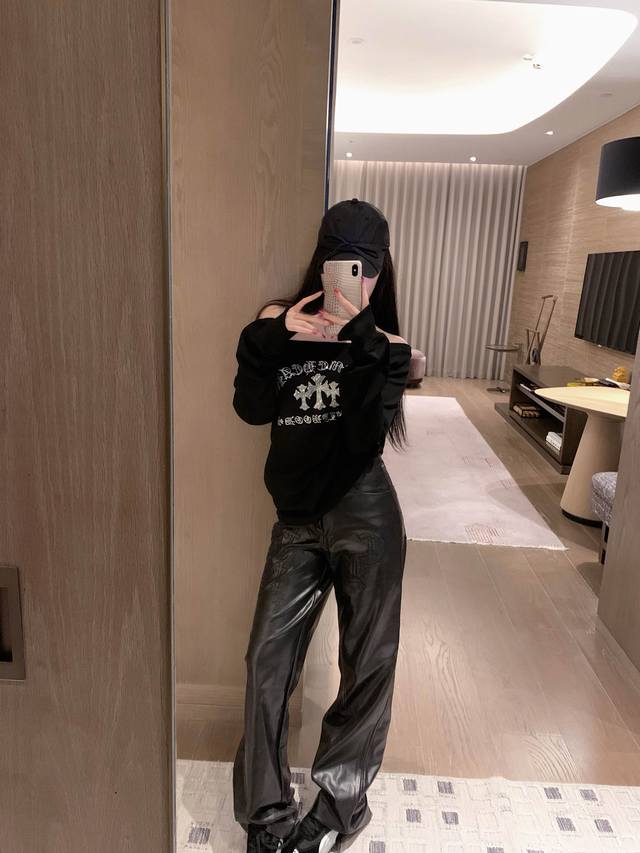 Chrome Hearts off-shoulder rhinestone cross sweatshirt, black and white