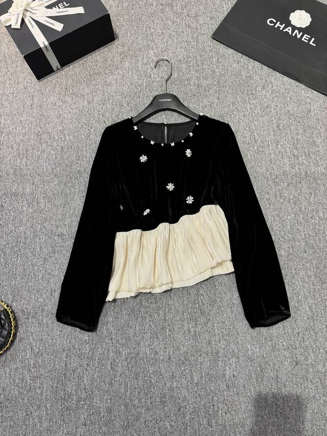 A blouse embellished with beaded flowers and a colorblock pattern! A ladylike l