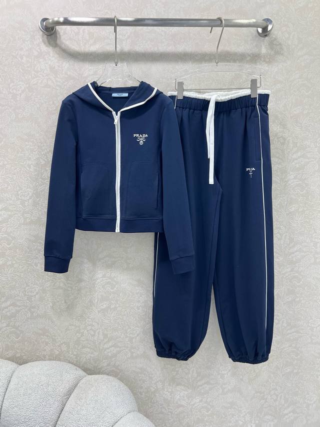 prad*25's newest set: a slim-fitting hooded zippered jacket and cuffed trousers.