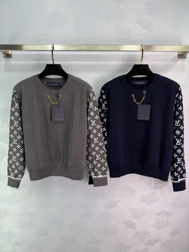 Lou*25's new early fall classic floral sleeve knit sweater features a gold chain