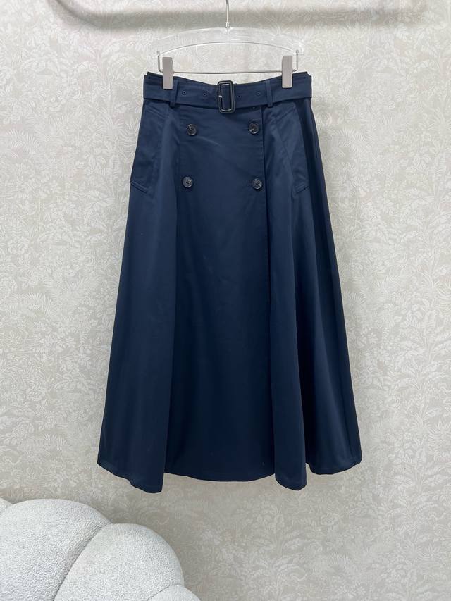 Burberr* 25's new double-breasted design features a custom logo on the fabric wa