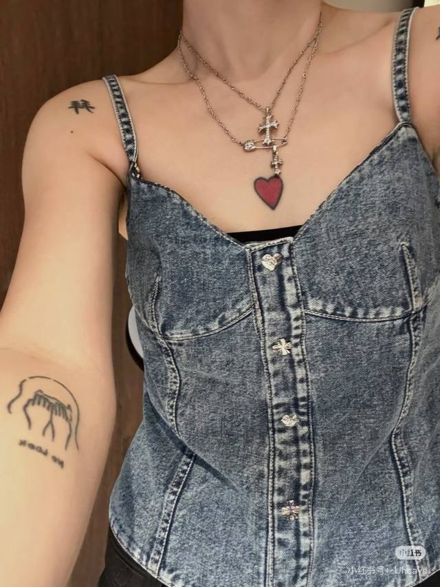 25This denim blue tank top is perfect for early fall. Made from classic denim, i