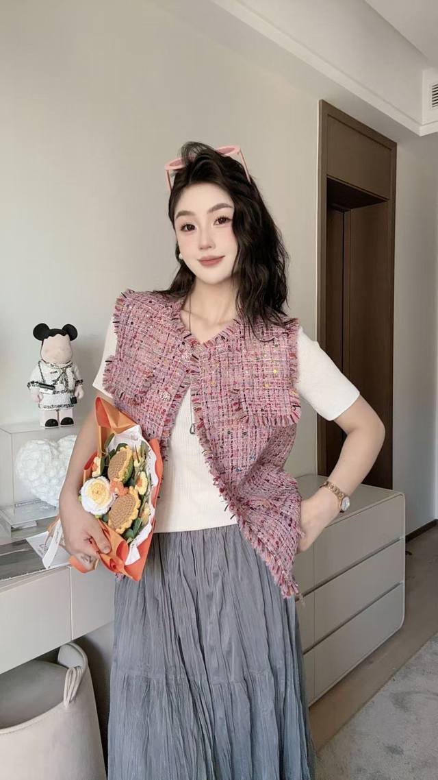 Luxury, elegant, and beautiful. This Chanel vest is full of girlish charm. The g