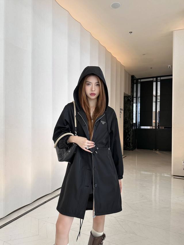 prad* Hooded long coat. Drawstrings at the waist and hem allow for easy adjustme