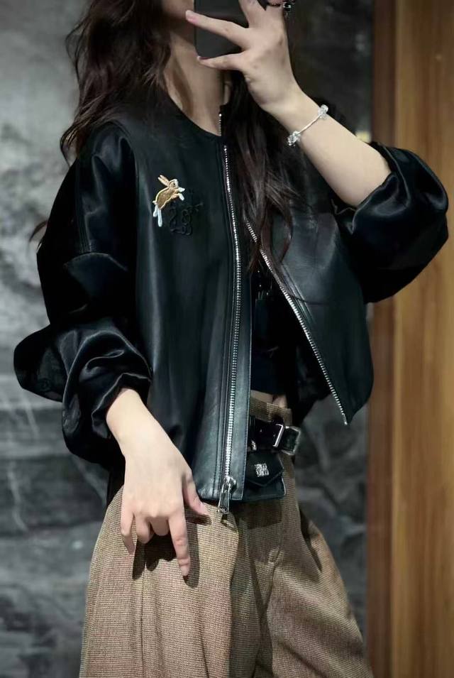 This European-made rabbit-embroidered leather jacket features high-quality, high