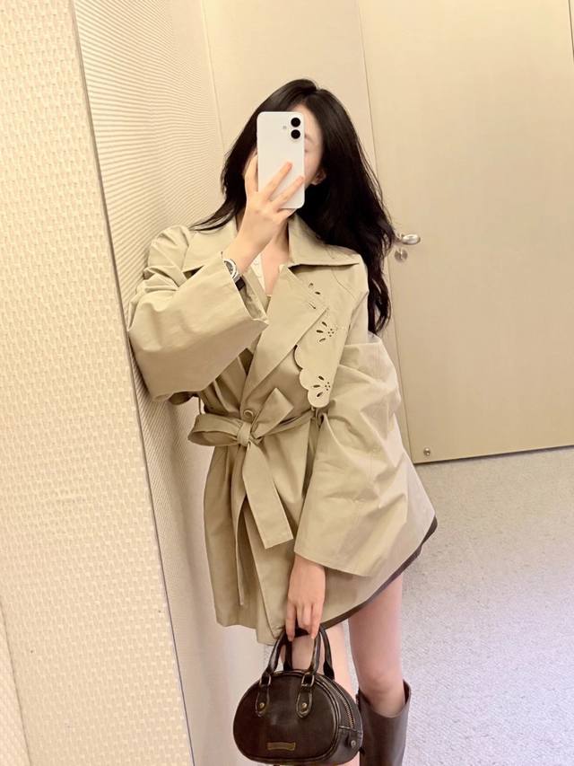 Hot trench coats are highly recommended. This short embroidered trench coat is r