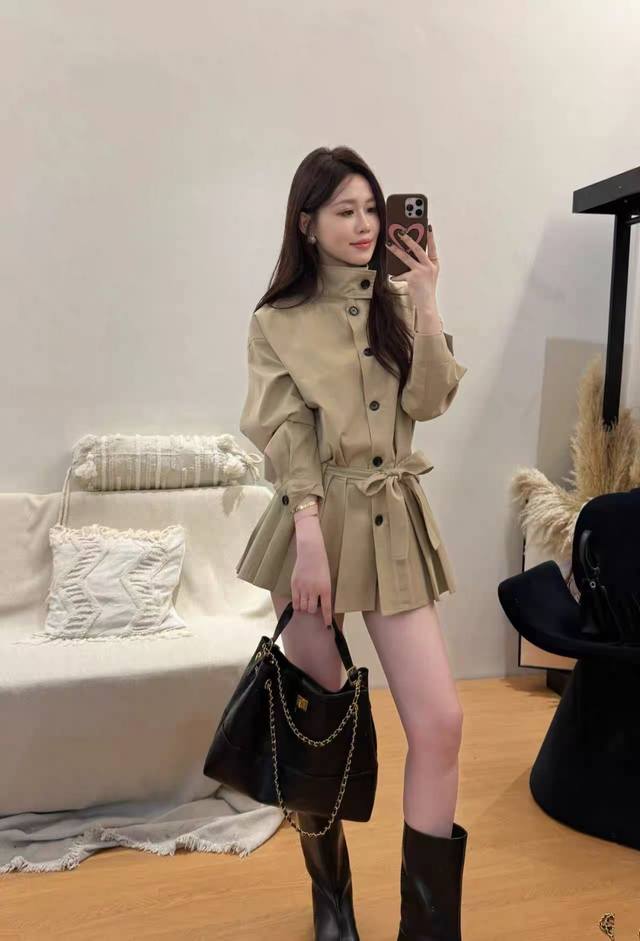 This Instagram blogger's fashionable trench coat features crisp shoulders for a