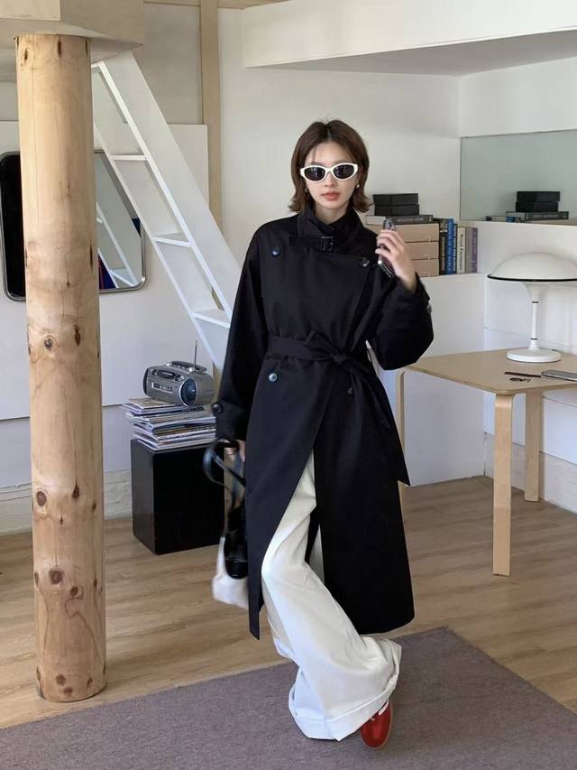 A stylish, luxurious trench coat with a modern, elegant feel. This long style is