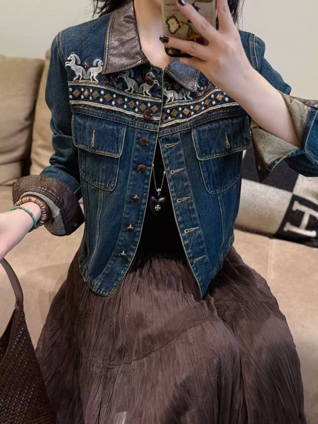 The loose-fitting denim jacket with delicate embroidery instantly enhances the o