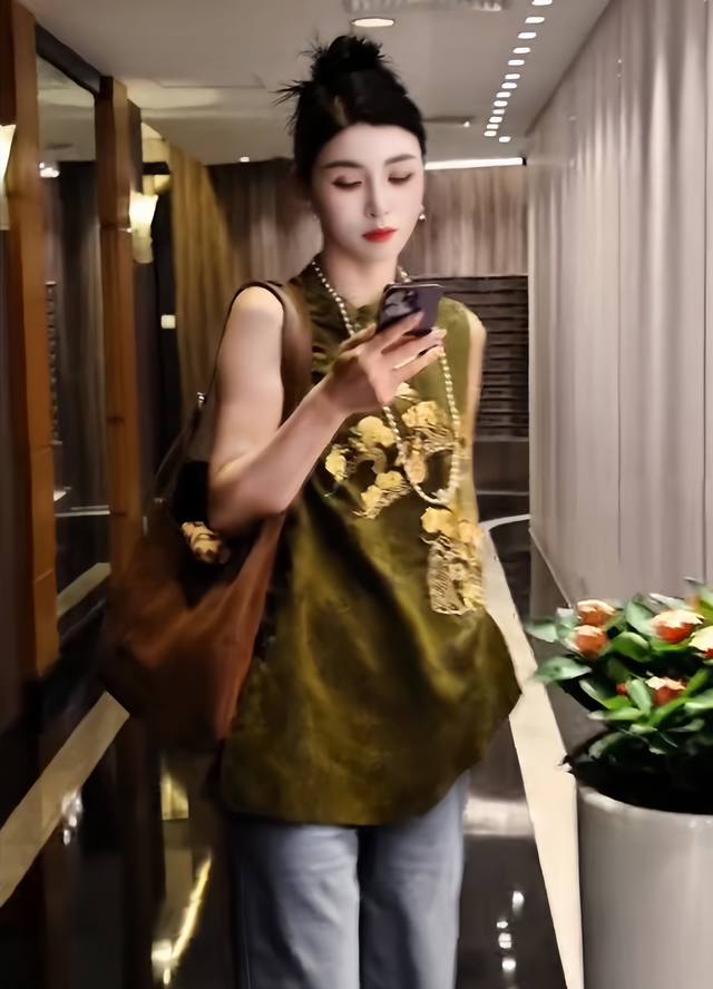 This is an incredibly popular mid-length vest with a sophisticated embroidery an