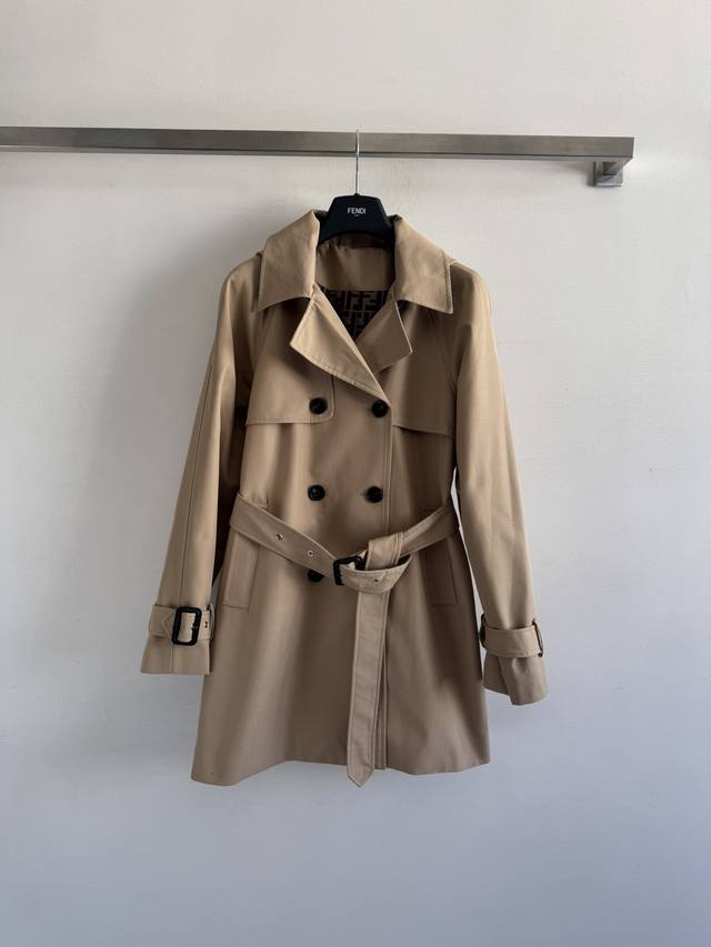 Fend* 25's new lapel belted trench coat features a detachable hood for casual or
