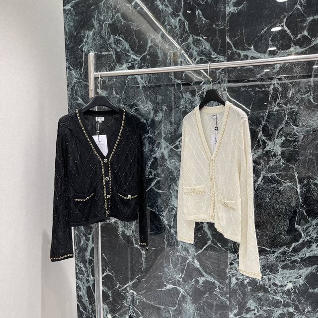 Chanel's new fall 2025 collection features a V-neck knitted cardigan with a hea