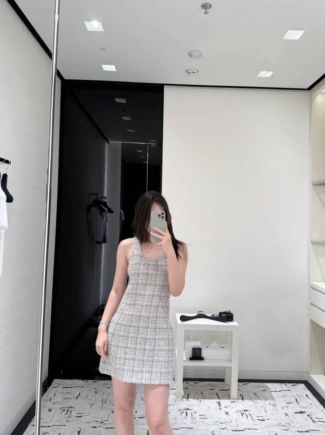 Chanel's new 2015 Early Fall Woven Hemmed Vest Dress. This dress features a sup