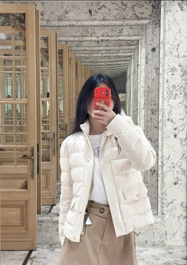Moncler's new stand-up lapel down jacket for early fall 2025. The stand-up colla