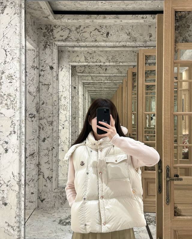 Moncler's new early fall 25 down vest with a detachable hood and stand-up collar
