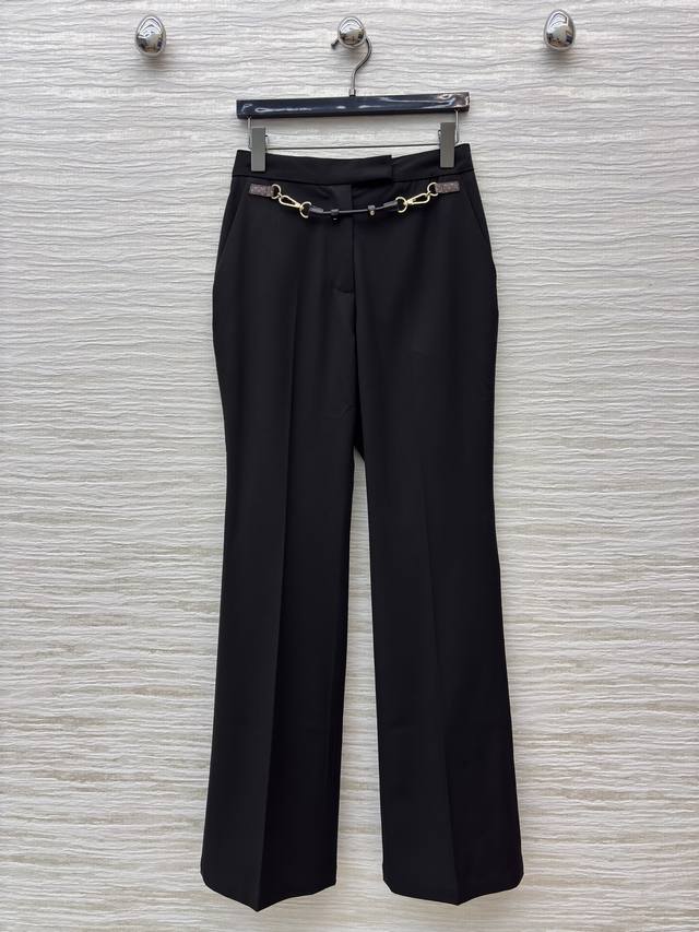 L's black flared trousers with leather buckle design and metal chain decoration
